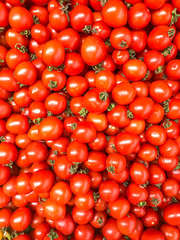 Vegetable background, texture, ripe red tomatoes in supermarket