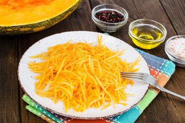 Vegetarian salad of fresh organic pumpkin, raw food