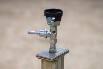 A silver drinking fountain 
