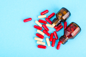 Medicine concept. Scattered capsules from prescription bottle