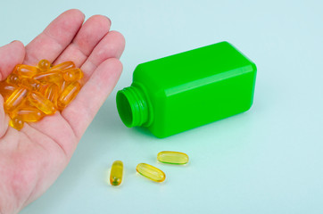 Different medical capsules, pills on palm.Concept of health protection
