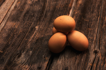 stack of eggs on wooden background horizontal with copy space