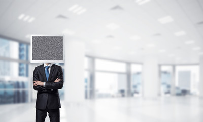 Businessman with monitor instead of head.
