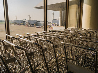 Luggage Cart beside the window in don muang internation airport bangkok City Thailand