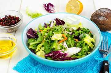 Salad from mix of herbs (iceberg, radiccio, friis, romance, carrot, arugula). Vegetarian, vegan concept