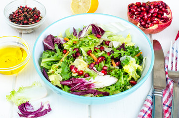 Fresh green salad with pomegranate, vegetarian menu