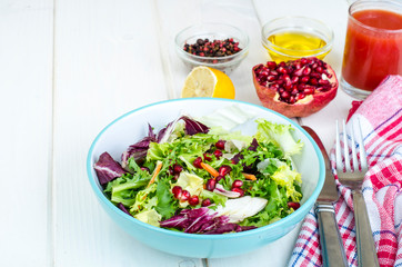 Fresh green salad with pomegranate, vegetarian menu