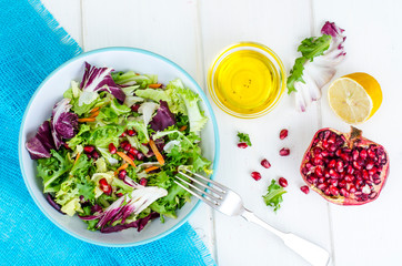Fresh green salad with pomegranate, vegetarian menu