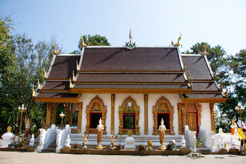 Thai people travel visit and respect praying chedi and Buddha's relics at Wat Phra That Doi Tung in Chiang Rai, Thailand
