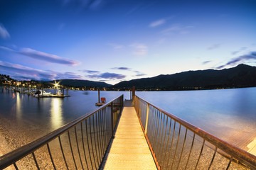 Fototapeta na wymiar Taken in Wanaka, New Zealand, this harbor dock is a gateway to sail the beautiful lake.