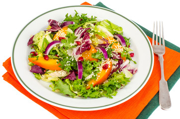 Salad with persimmon and sesame seeds, healthy food.