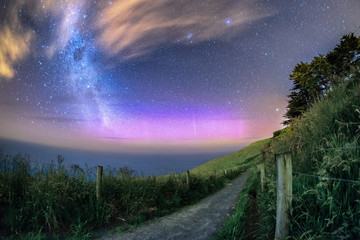 Beautiful southern lights caught together with Milky Way galaxy in Dunedin, New Zealand. There is a...