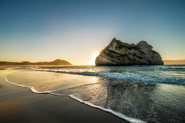 This was taken in New Zealand beach. The sunrise produces smooth and colorful sky. The water...