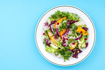 Plate with salad on bright background