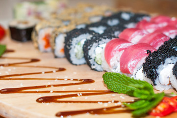 beautiful sushi, rolls, with caviar and fresh fish, close-up