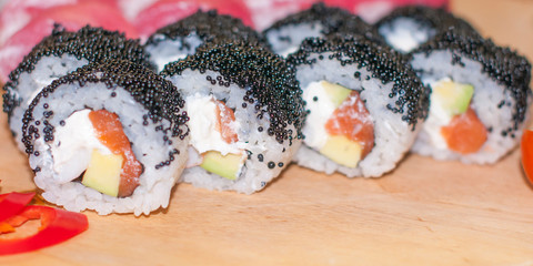 beautiful sushi, rolls, with caviar and fresh fish, close-up