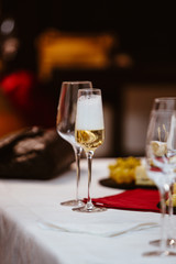 A glass of white champagne sparkling bubble wine