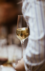 A glass of white champagne sparkling bubble wine