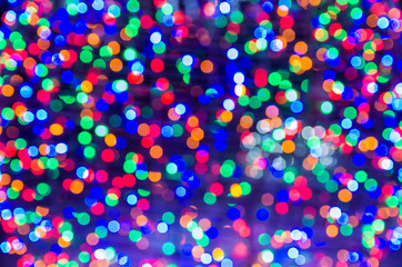 multicolored Christmas lights in defocus; christmas background