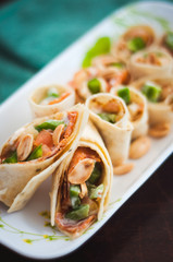 Sushi-Style Wraps with chicken pepperoni, vegetables and nuts. Healthy snacks.