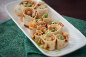 Sushi-Style Wraps with chicken pepperoni, vegetables and nuts. Healthy snacks.