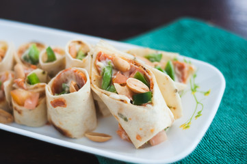 Sushi-Style Wraps with chicken pepperoni, vegetables and nuts. Healthy snacks.