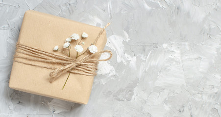 Gift boxes with small white flowers