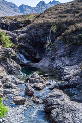 Obraz premium Fairy Pools, Rocks and Waterfall In Isle Of Skye