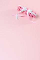Pink macaroons on a pink background. Gift for Valentine's day. Ideal for holiday of international women's day.