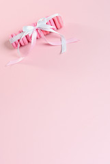 Pink macaroons on a pink background. Gift for Valentine's day. Ideal for holiday of international women's day.