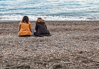 Women sitting at the beach