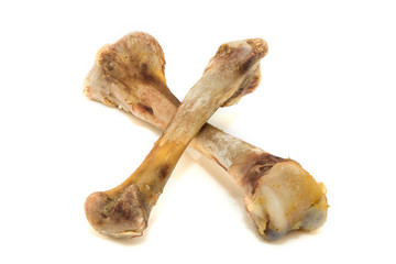 Fototapeta premium bone chicken on a white background. bones isolated on white background. Top view of a chicken bone with almost all of the meat eaten off isolated on a white background. 