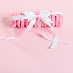 Pink macaroons on a pink background. Gift for Valentine's day. Ideal for holiday of international women's day.
