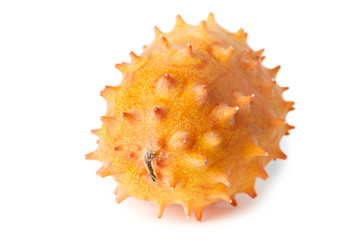 Horned melon or kiwano (Cucumis metuliferus), also known as African horned cucumber or melon, jelly melon, hedged gourd and melano isolated on white background