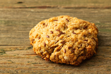 Oatmeal cookies with milk on tray on rustic wooden table