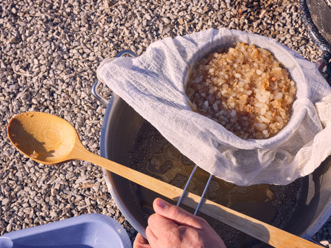 Crop hand cooking on gravel