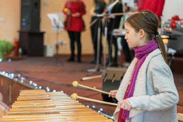 Girl 9 years old playing professional xylophone