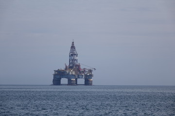 An oil drilling platform in the mist of the west African coast