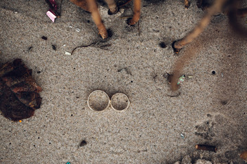 Wedding rings on the sand