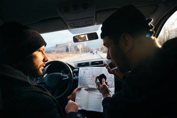 Bank robbers,planning their next hit while holding a gun and counting on a stop watch the time they need to get from one point on the map to another one.