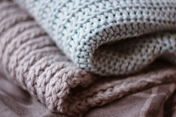 Fototapeta na wymiar two warm wool sweaters lying in a pile
