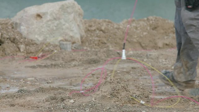 Connecting explosives cables in open limestone quarry