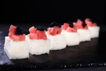 seafood restaurant menu, pressed sushi with cream cheese, tuna and caviar, Japanese food art, delicacy, banquet 