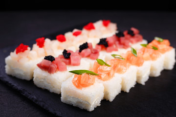 Delicious pressed sushi with cream cheese, tuna, scallop and salmon, Japanese food art, seafood restaurant menu, delicacy, banquet 