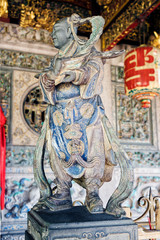 The stone child symbolizes the beckoning of wealth (zhao cai) in Leong San Tong Khoo Kongsi, in George Town, Penang, Malaysia