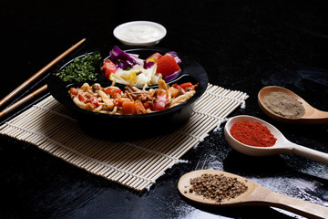 ready meal to eat in lunch box with sticks and sauce, closeup
