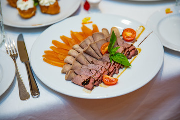 Fresh cold cuts on the white plate