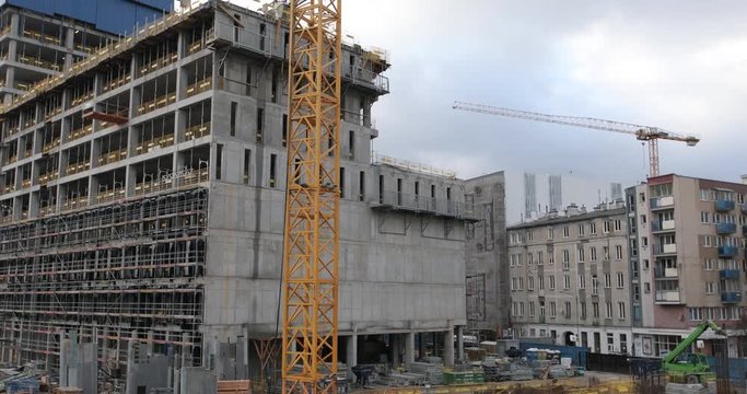 4K Footage of a uncomplete new building been built where the scaffolding and structure is still been layed. - Video