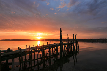 gorgeous seascape with romantic pier at sunset, burial at sea, sympathy card