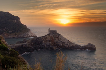 The Church of San PIetro, St. Peter, Portovenere, province of La Spezia, northern Italy, facing the Gulf of Poets. Winter sunset.